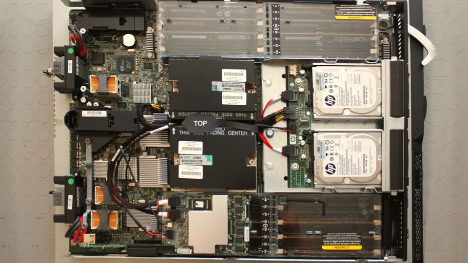 Inside a blade server: circuit boards, memory modules and two hard drives