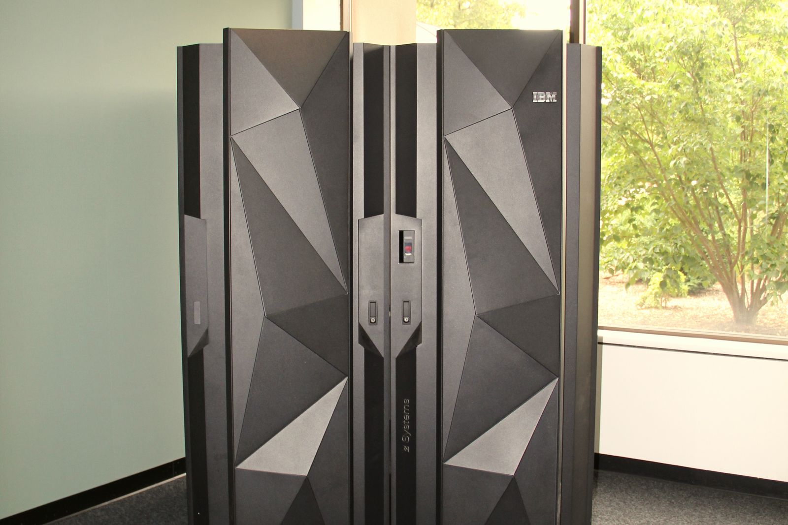 A modern mainframe computer cabinet standing in an office