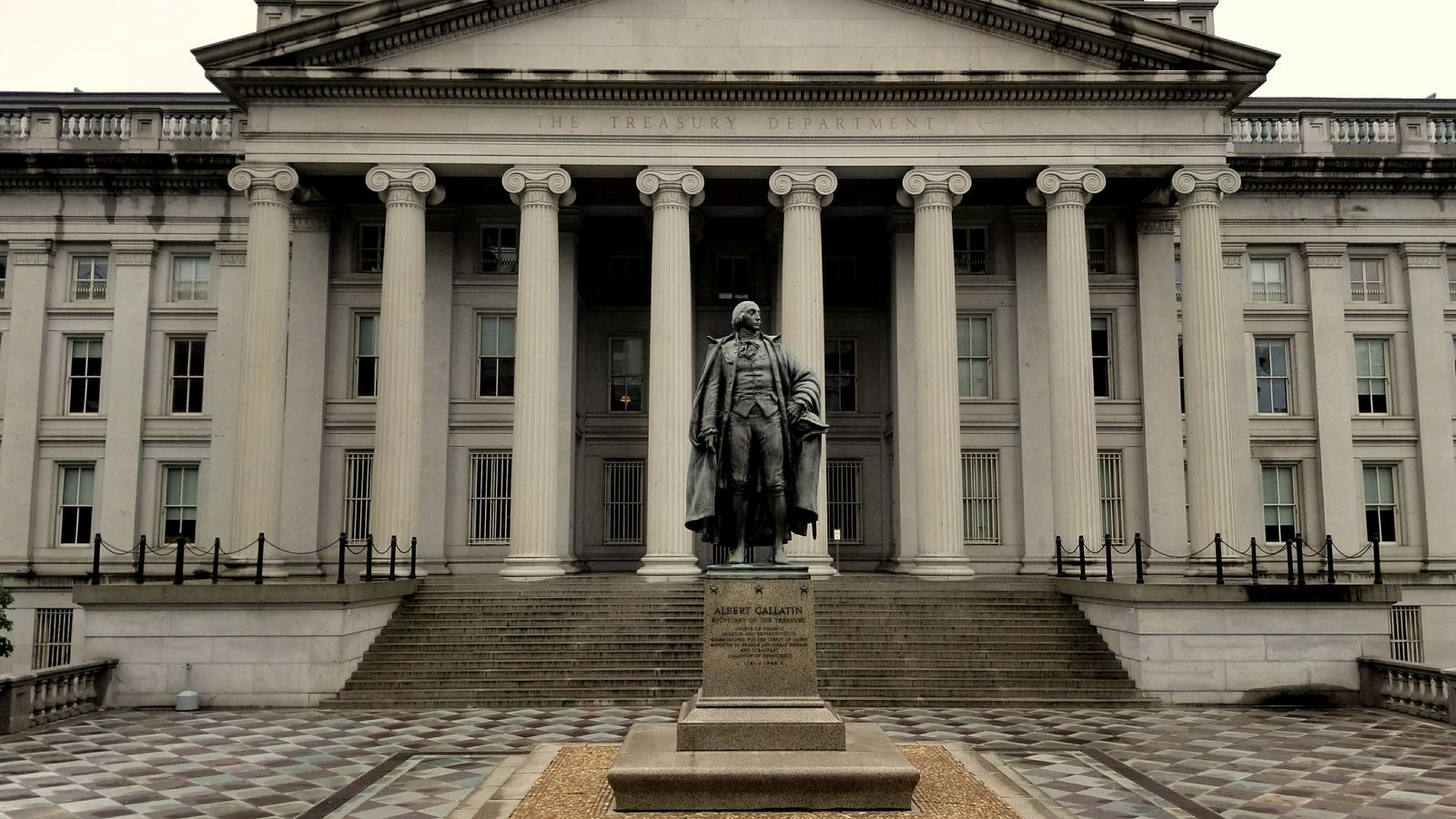 The U.S. Treasury Building in Washington, D.C., with the statue of Albert Gallatin in front
