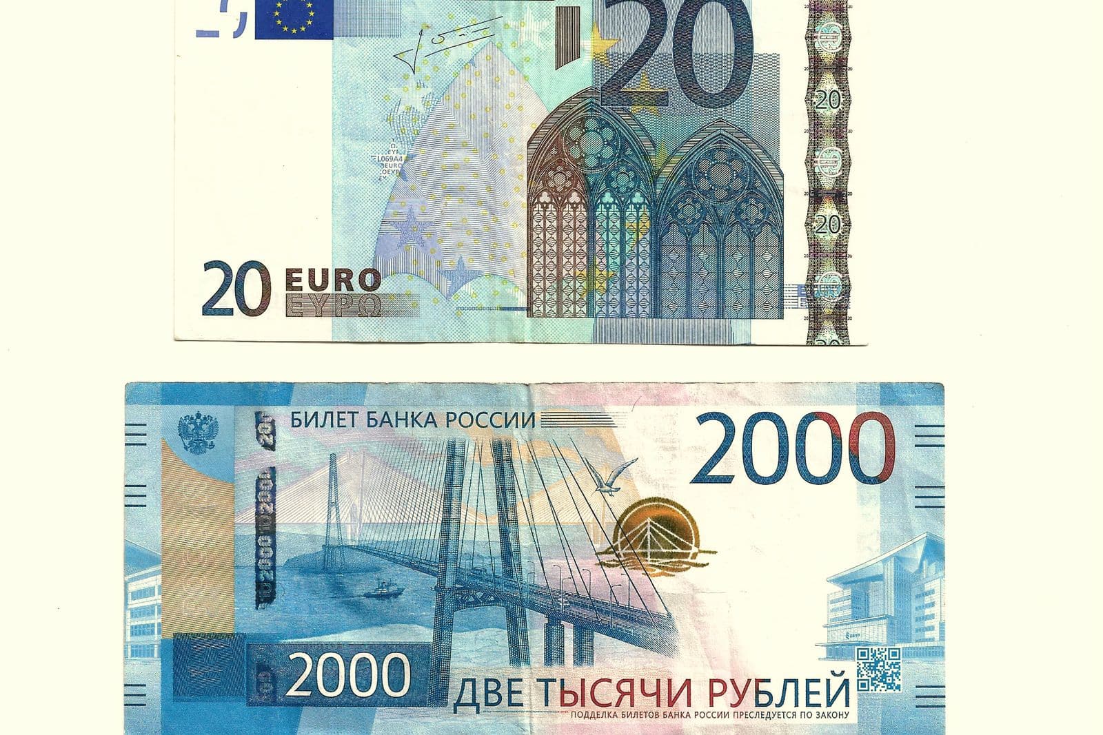 A 20 euro banknote and a 2,000 rouble banknote