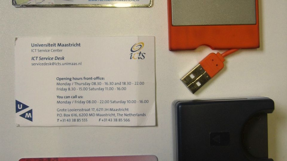 Several bank cards and card-sized objects laid out on a table