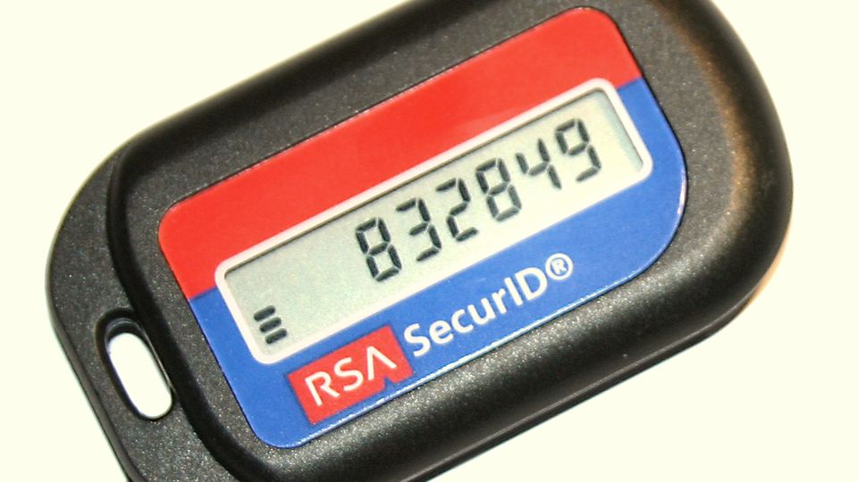A key-fob security token displaying a six-digit one-time code