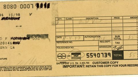 An old-style carbon-copy credit card receipt