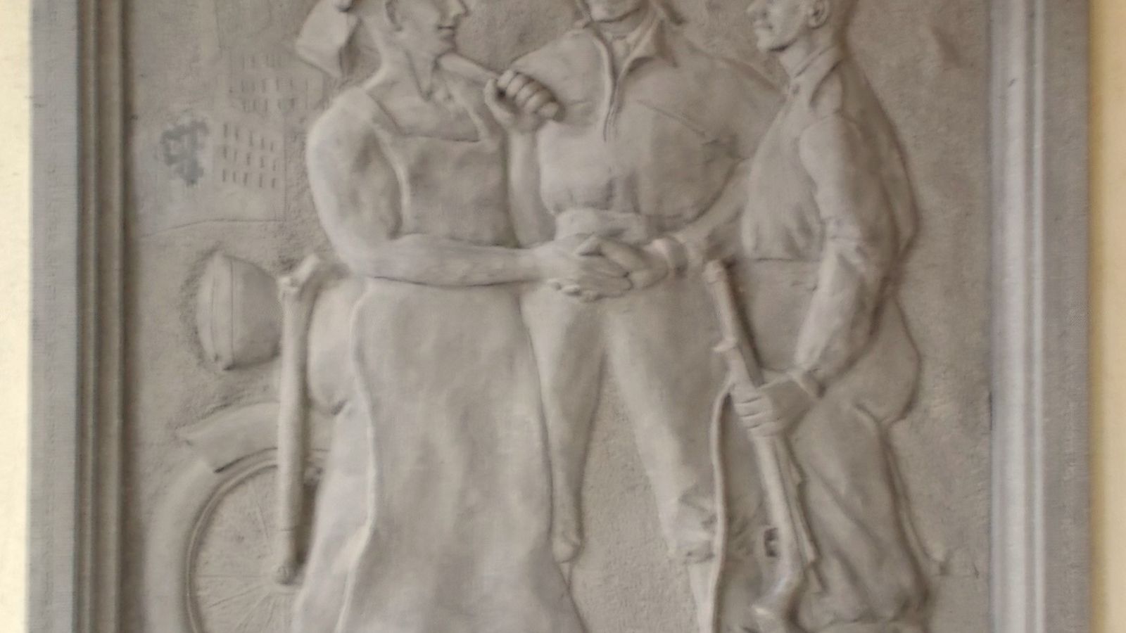 A stone relief showing two figures shaking hands