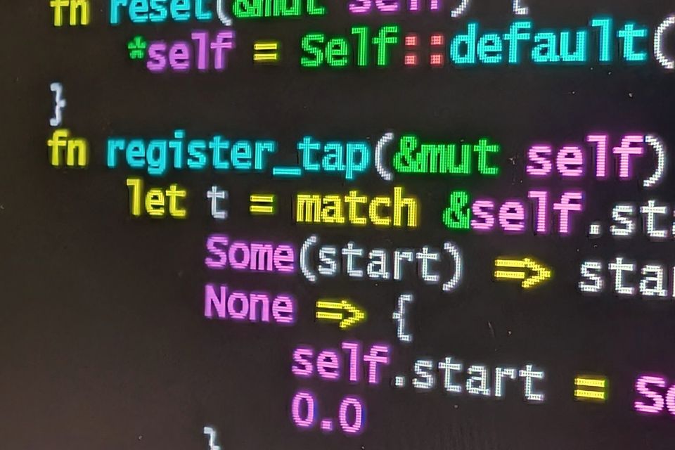 Colour-highlighted program code on a screen