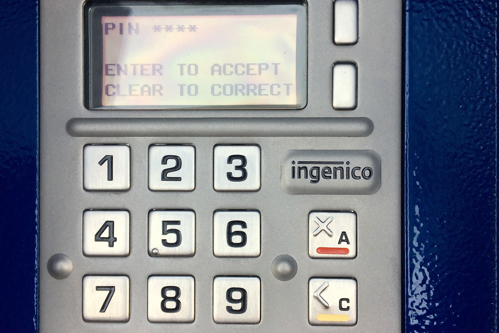 Close-up of a payment terminal keypad used to enter a PIN
