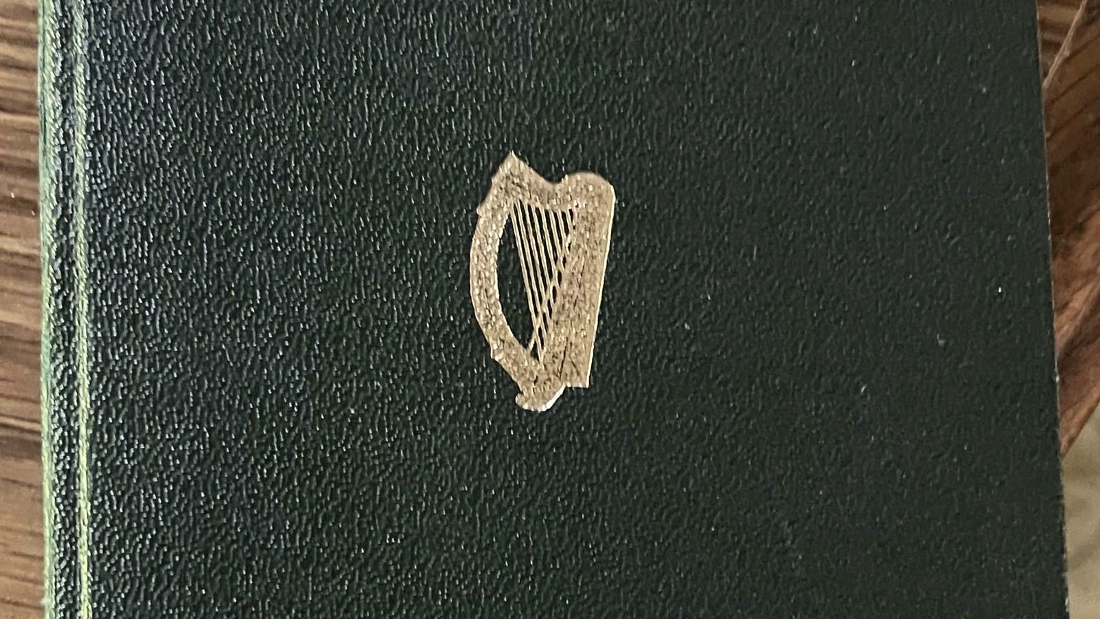 The dark green leather cover of an old Irish passport