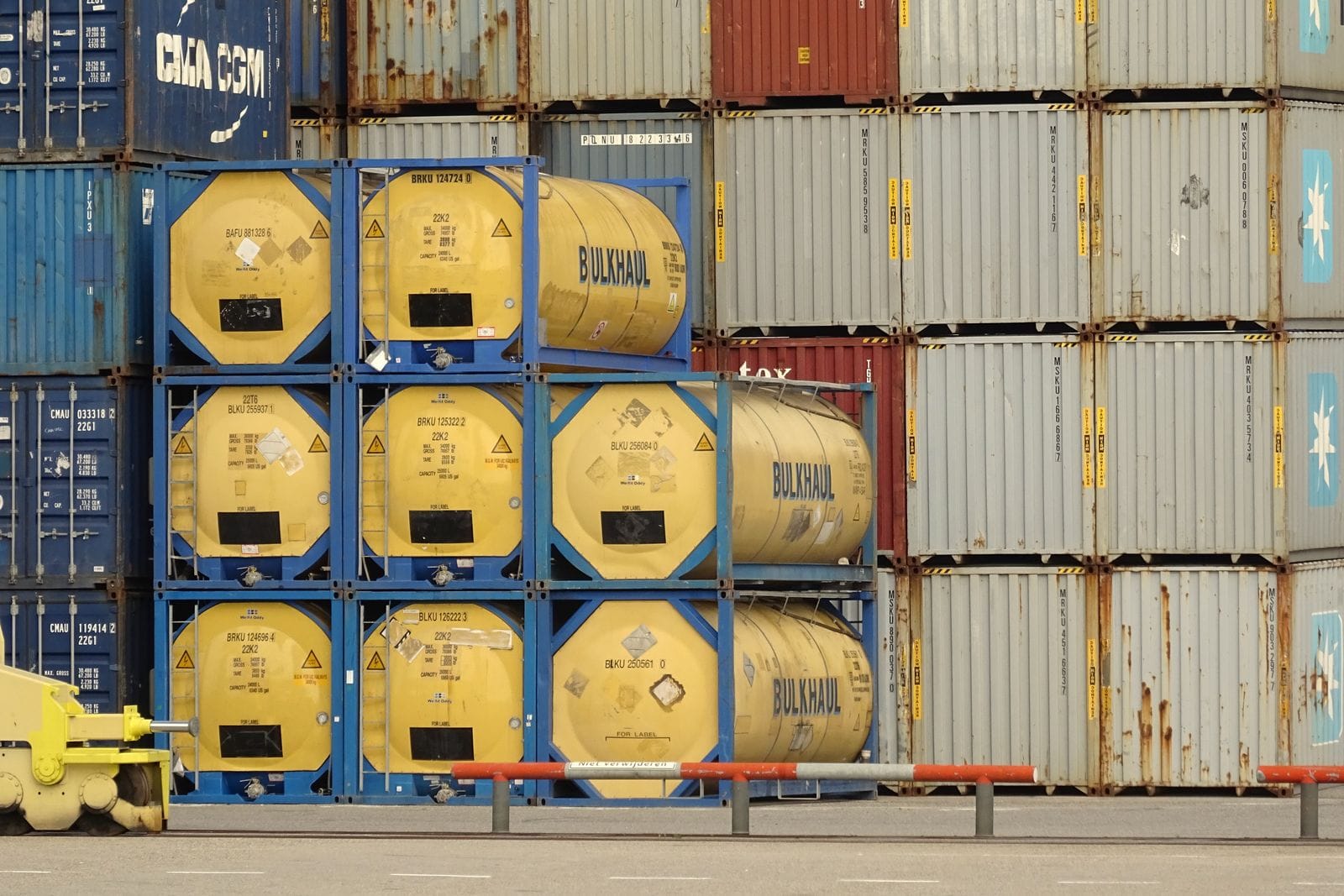 Tank containers and box containers stacked at a port terminal