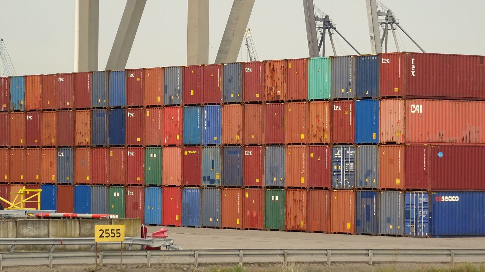 Stacks of colourful shipping containers at a port