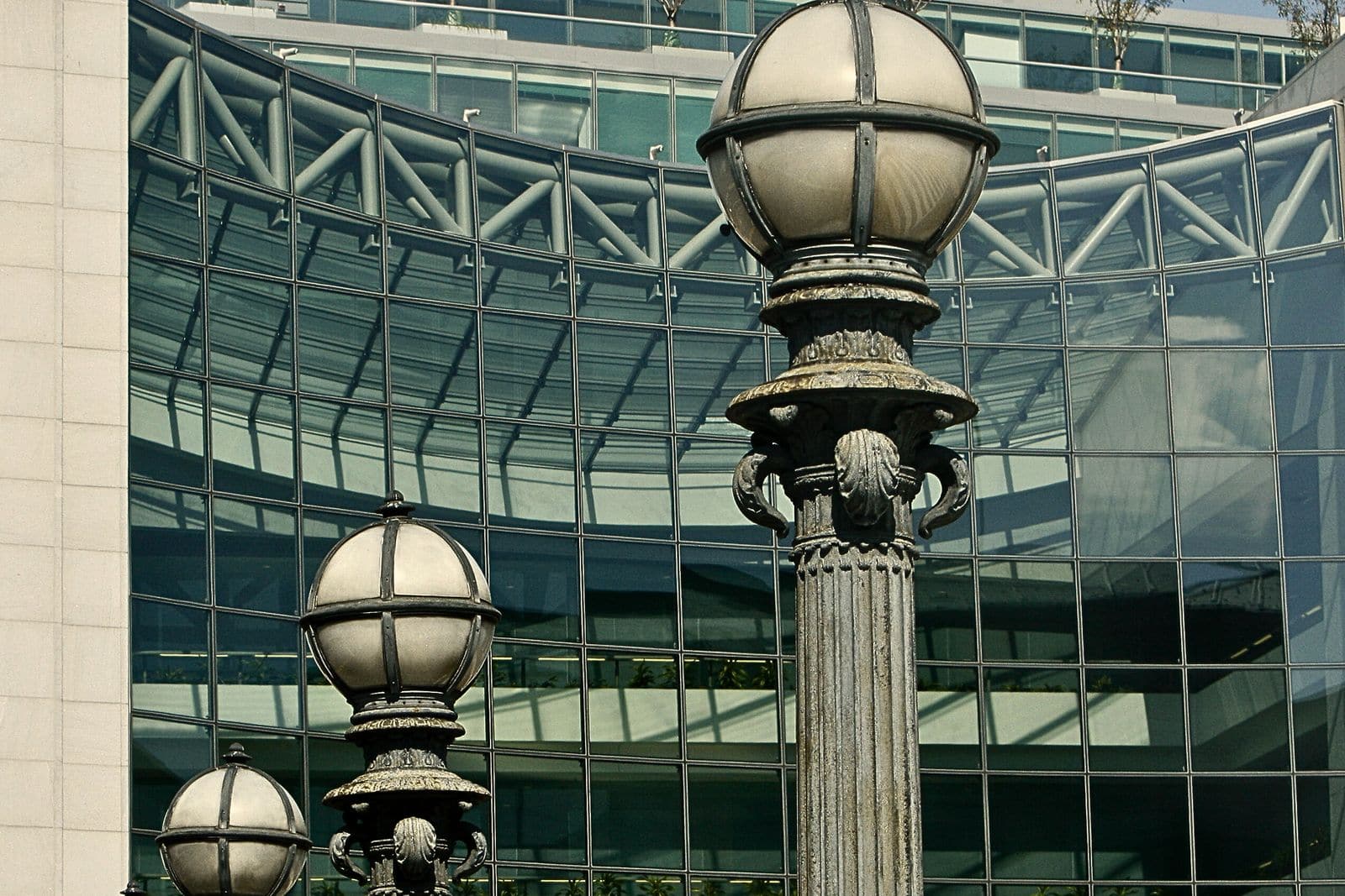 Street lamps in front of the SEC building's glass facade